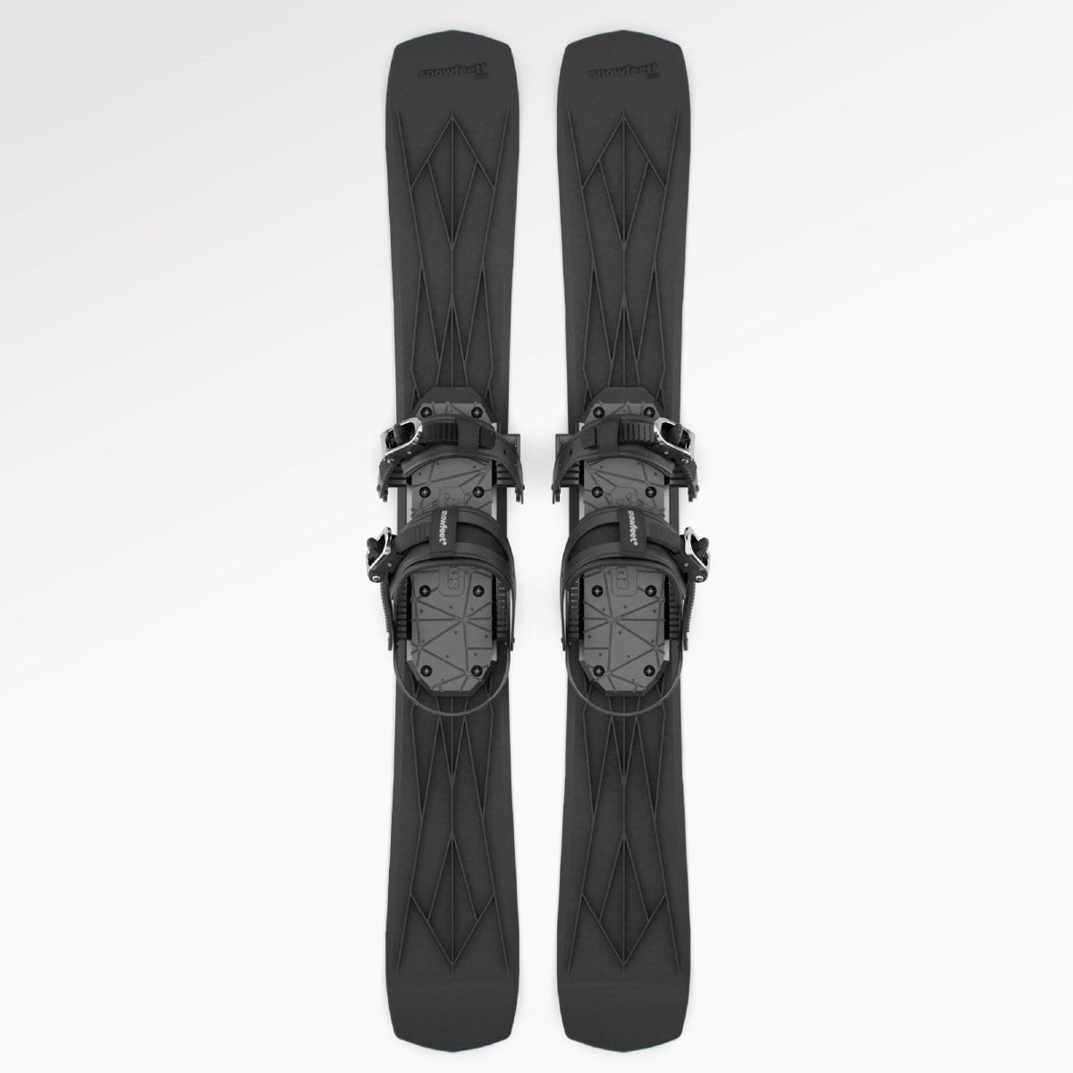 Pair of black short skis Snowfeet with snowboard bindings on a white background