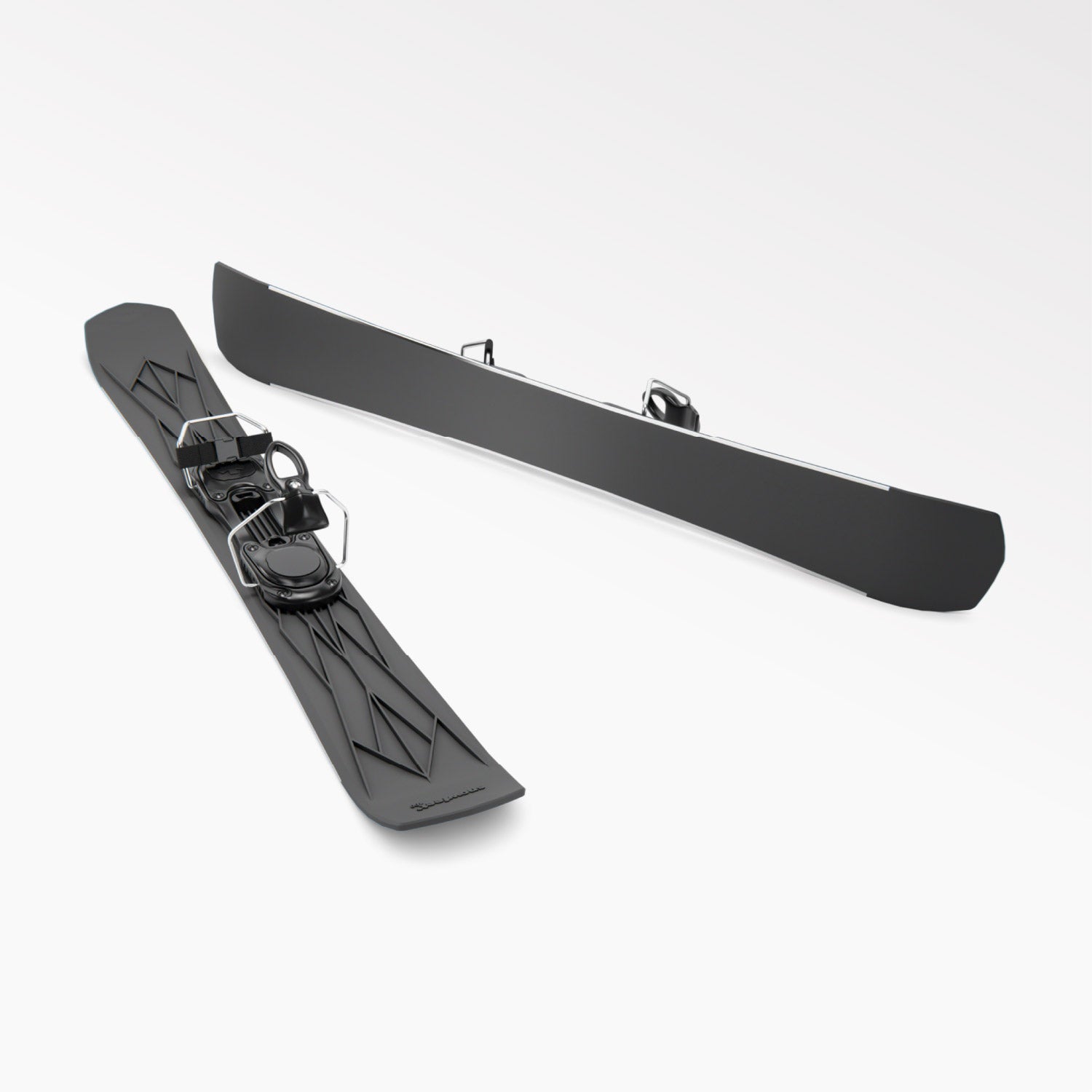Pair of black short skis Snowfeet with ski bindings on a white background