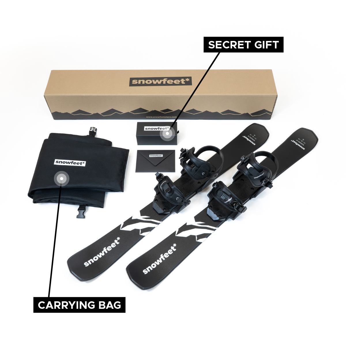 Snowfeet 99 unboxed photo. Equipment set with 'snowfeet' branding, including skis, bindings, and a carrying bag, on a white background.
